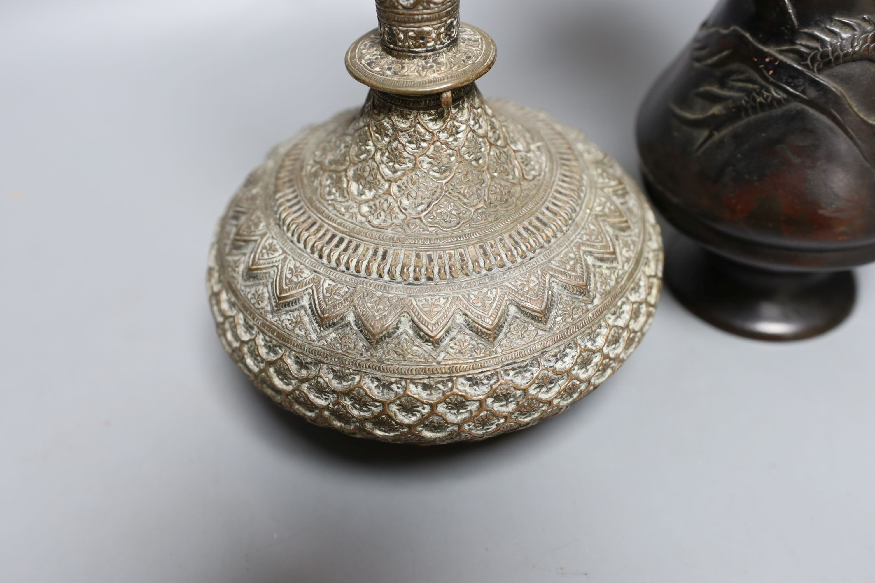 A Japanese bronze vase, an Islamic brass bottle, Chinese enamelled porcelain bowl, bronze group of man riding an ox. 29cm